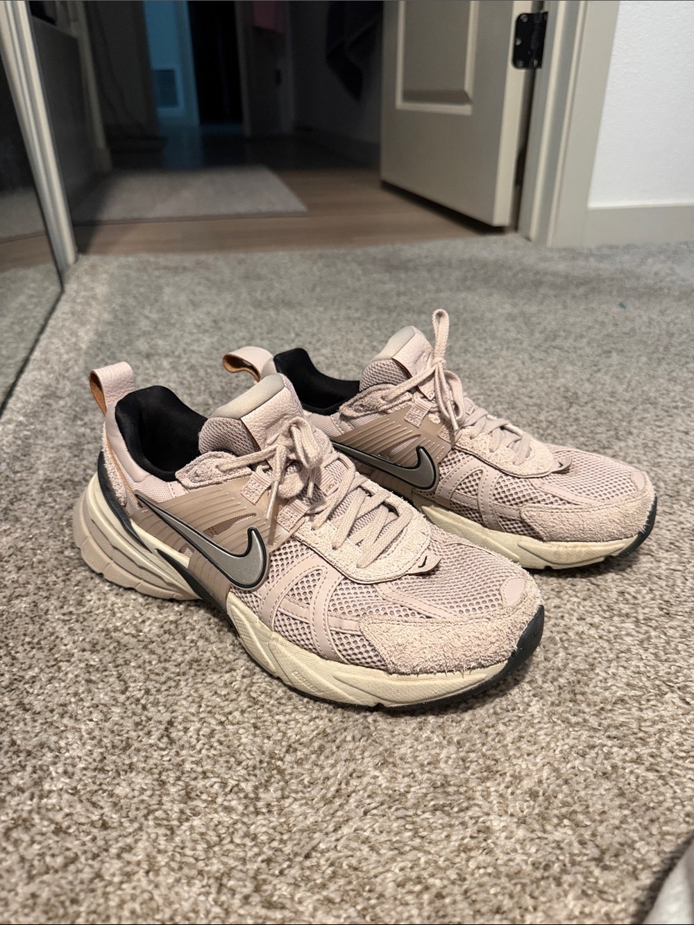 Nike Women’s Blush Pink Athletic Running Shoes with Silver Swoosh